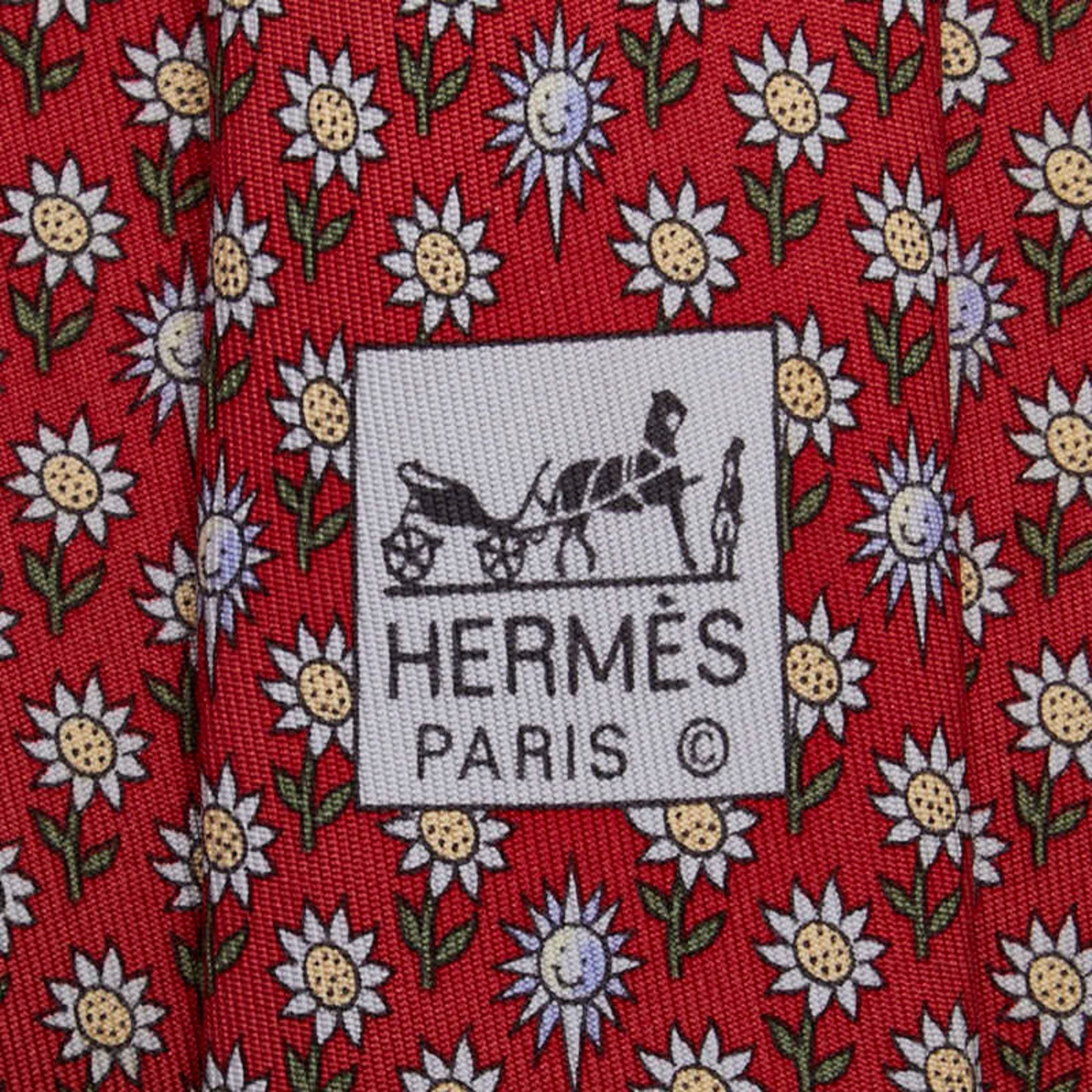 Hermes floral sunflower motif tie in red and multicolored silk .