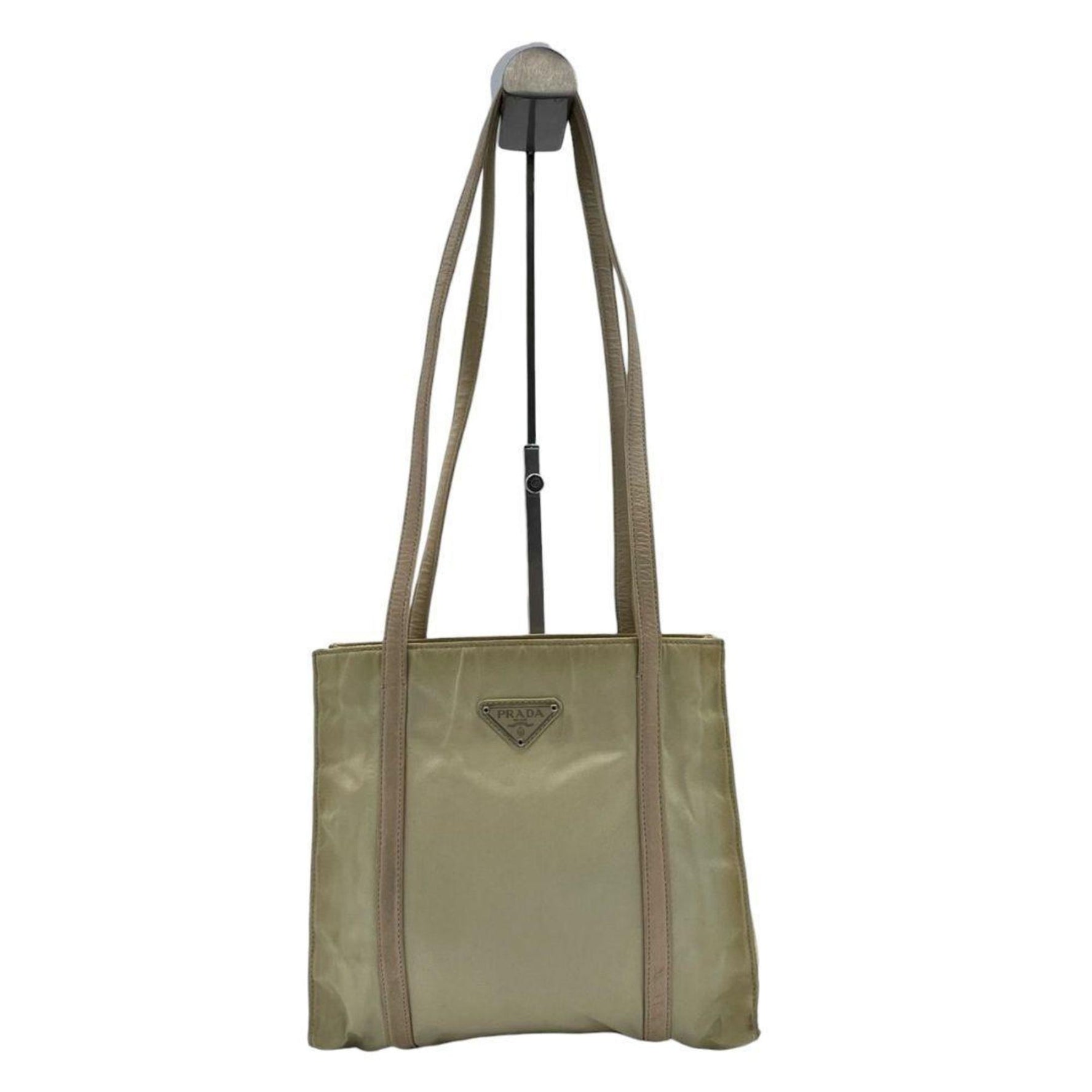 Prada Tessuto tote bag in with a triangular logo plate and silver hardware. Can be worn over the shoulder or on shoulder.