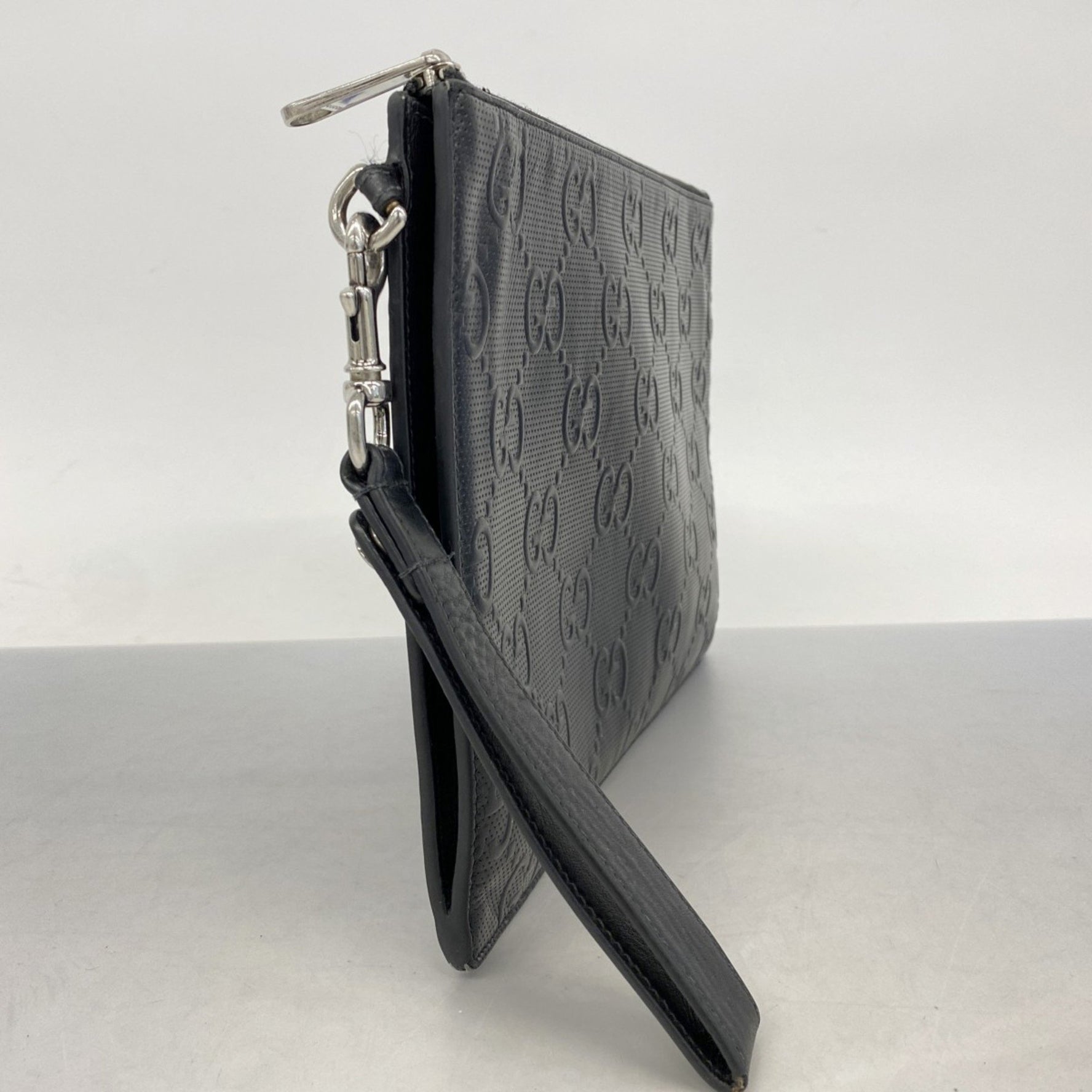 Gucci GG Embossed Clutch Bag Leather