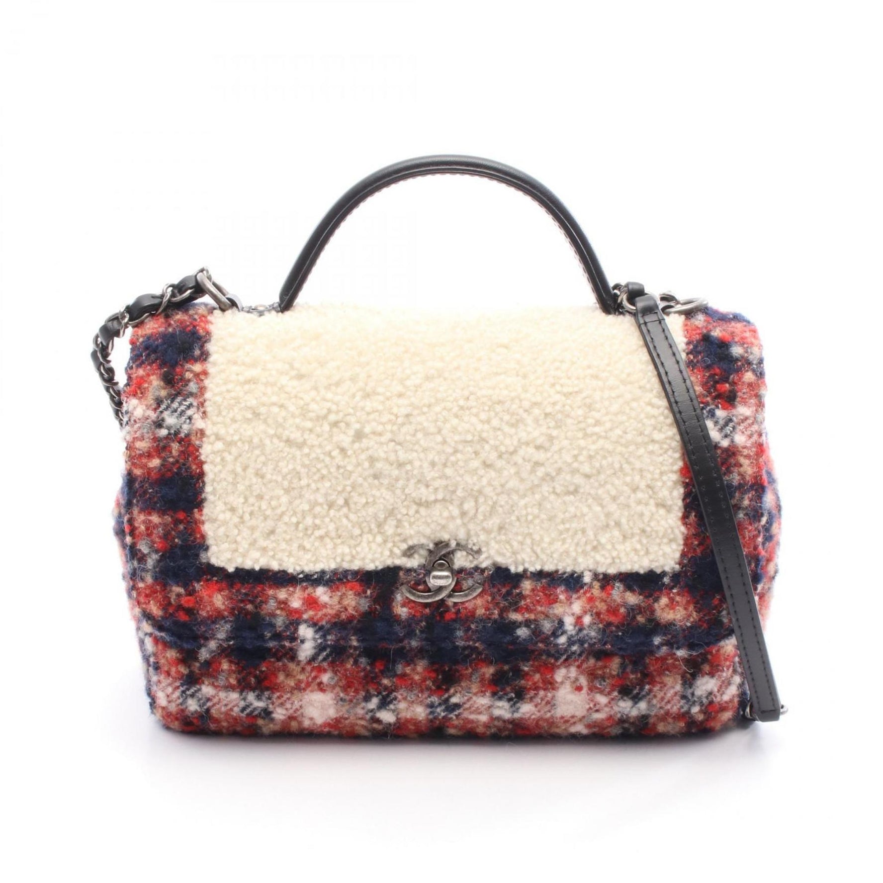CHANEL top handle shoulder bag made of shearling, wool, and leather. Available in red, beige, multicolor.