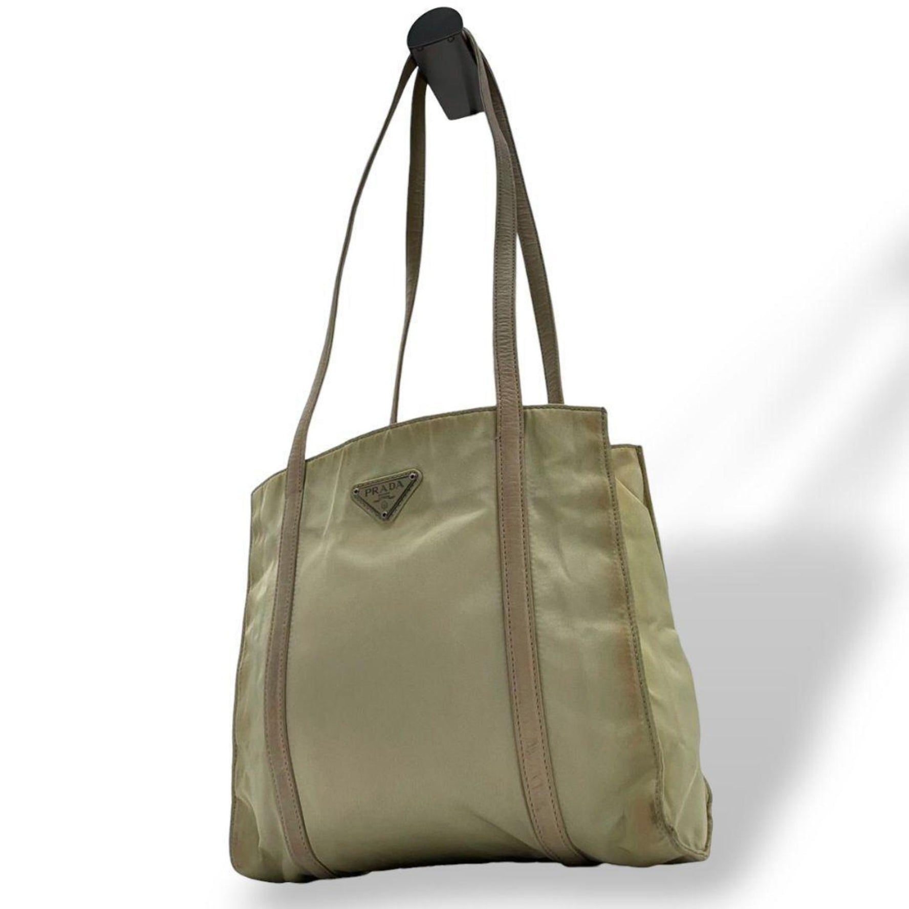 Prada Tessuto tote bag in with a triangular logo plate and silver hardware. Can be worn over the shoulder or on shoulder.