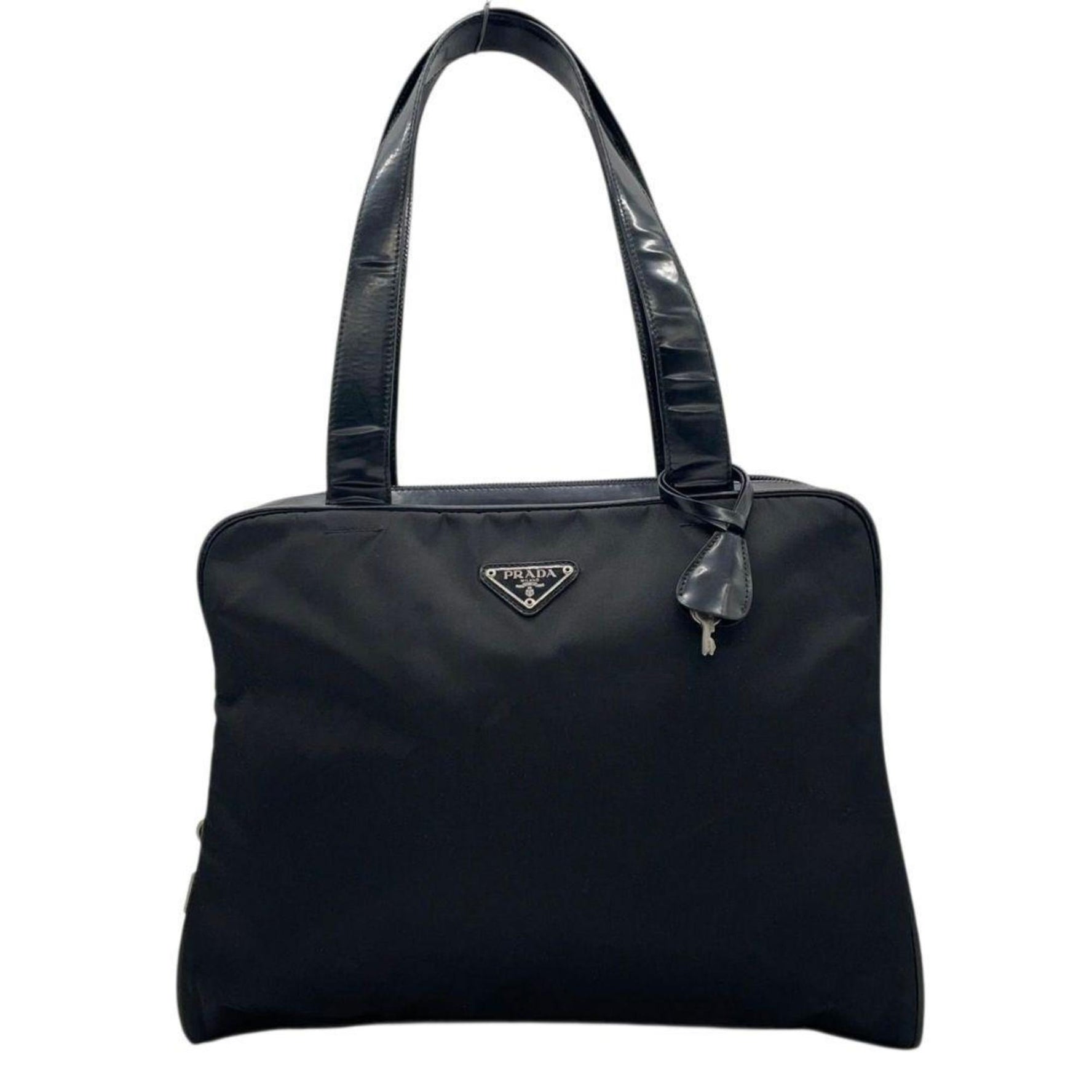 Prada Tessuto handbag in nylon, leather, and enamel with a triangular logo plate. One-shoulder tote bag. Can be worn over the shoulder. 31