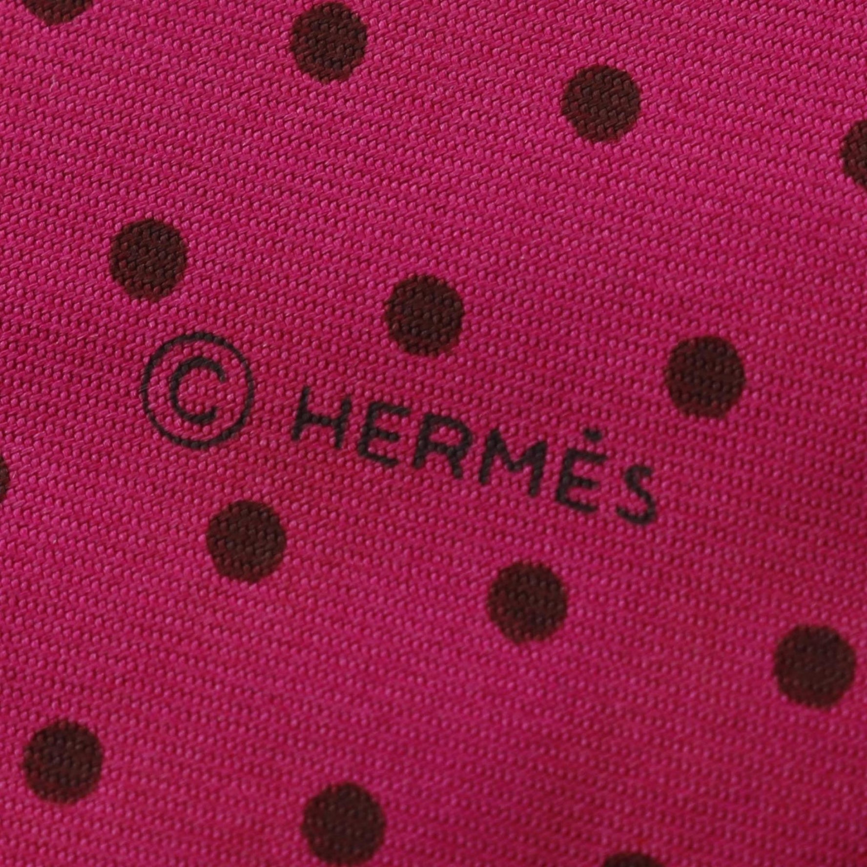 Hermes silk scarf in pink, black, and gray.